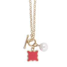 Load image into Gallery viewer, Front view of the pink quatrefoil pearl necklace
