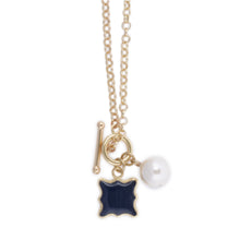 Load image into Gallery viewer, Front view of the navy quatrefoil pearl necklace