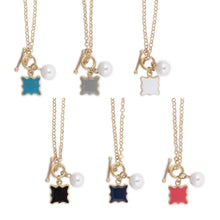 Load image into Gallery viewer, Front view of all the colors of the enamel quatrefoil pearl necklace