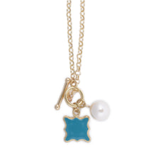 Load image into Gallery viewer, Front view of the turquoise quatrefoil pearl necklace
