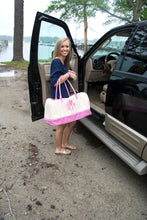 Load image into Gallery viewer, Model carrying a monogrammed pink gingham duffle bag