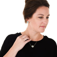 Load image into Gallery viewer, Lifestyle view of our Gray Pebble Grain Circle Necklace