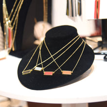 Load image into Gallery viewer, Lifestyle view of our Pebble Grain Rectangle Necklaces