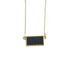Load image into Gallery viewer, Top view of our Black Pebble Grain Rectangle Necklace