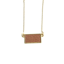 Load image into Gallery viewer, Top view of our Camel Pebble Grain Rectangle Necklace