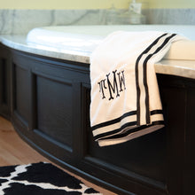 Load image into Gallery viewer, Lifestyle of the black and white canvas ribbon bath wrap with monogram
