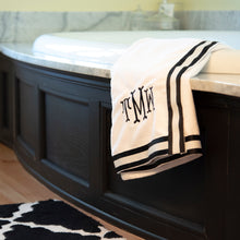 Load image into Gallery viewer, Lifestyle of the black and white canvas ribbon bath wrap with monogram