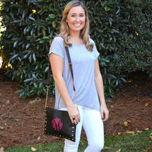 Load image into Gallery viewer, Young woman with a black spring stud crossbody