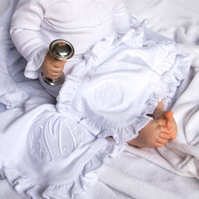 Load image into Gallery viewer, Lifestyle view of our Ruffle Burp Cloth