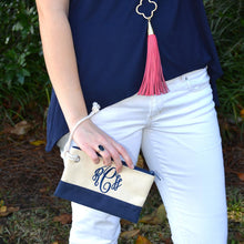 Load image into Gallery viewer, Model holding a monogrammed navy rope pouch with the string around her wrist