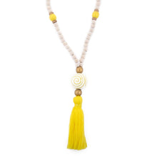 Load image into Gallery viewer, Natural wood bead necklace with yellow tassel featuring a large ceramic bead in the center
