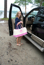 Load image into Gallery viewer, Model carrying a monogrammed pink gingham duffle bag
