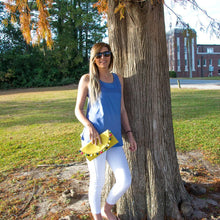 Load image into Gallery viewer, Model holding a yellow pom pom clutch
