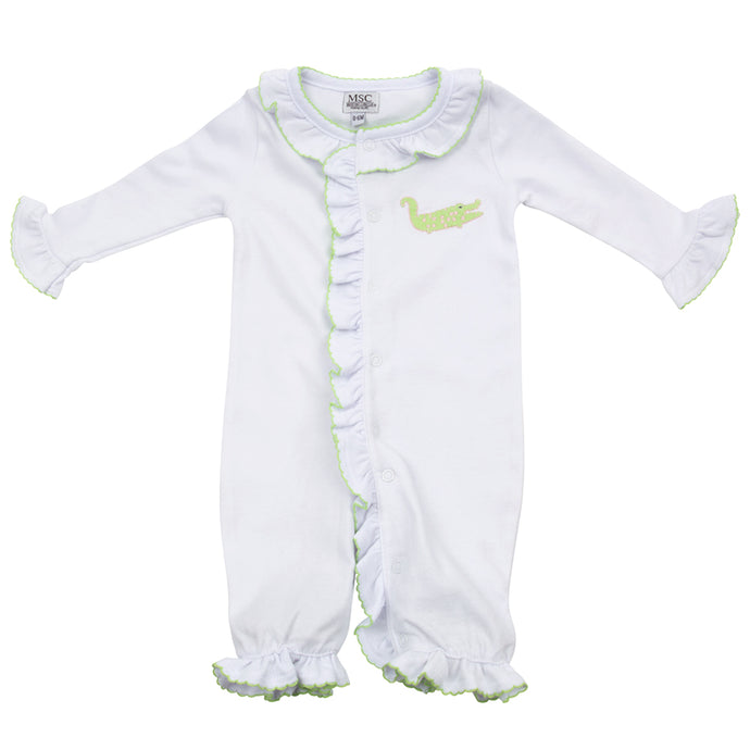 Baby onesie with an alligator applique on the left-hand side on the pocket area