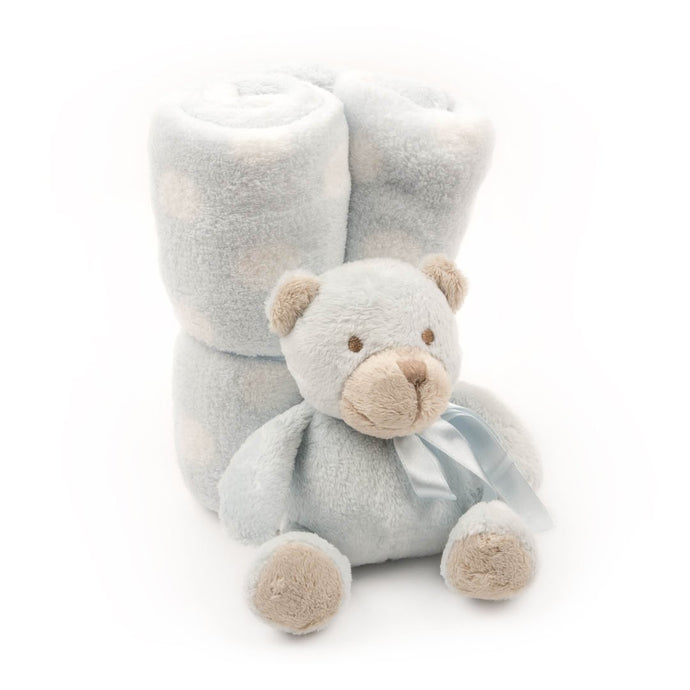 Wrapped plush blanket and plush bear tied with a bow