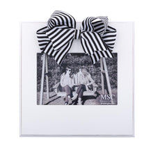 Load image into Gallery viewer, White frame with black and white stripe bow at the top of the frame, holds 4 x 6
