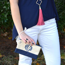 Load image into Gallery viewer, Model holding a monogrammed navy rope pouch with the string around her wrist
