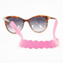 Load image into Gallery viewer, Lifestyle view of our Pink Lizard Scallop Sunglass Strap
